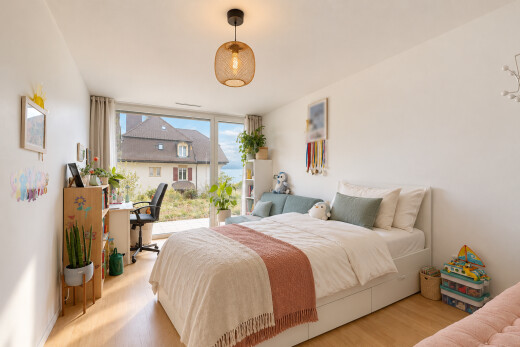 room featuring a desk, pendant lighting, and light wood-style floors