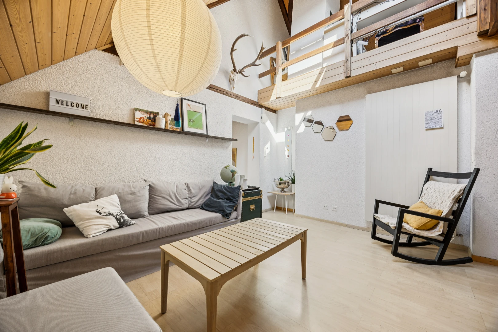 living room with light wood-style floors and a vaulted wood ceiling