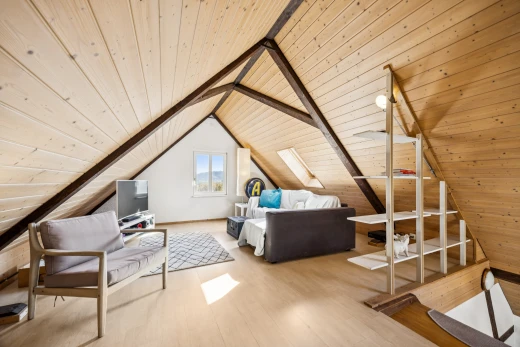living area featuring a wooden ceiling with exposed beams and light wood-type flooring