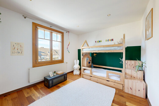 living room with light wood-style flooring and radiator