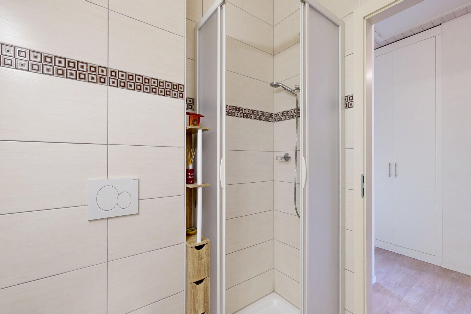 bathroom featuring a shower stall and light wood finished floors