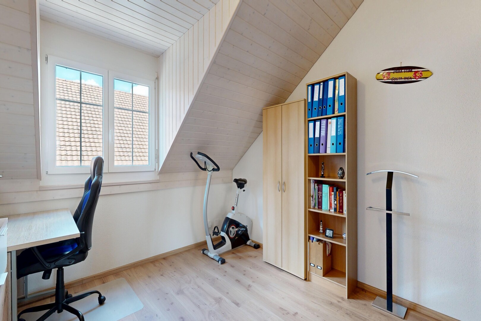 office area featuring light wood finished floors and lofted ceiling