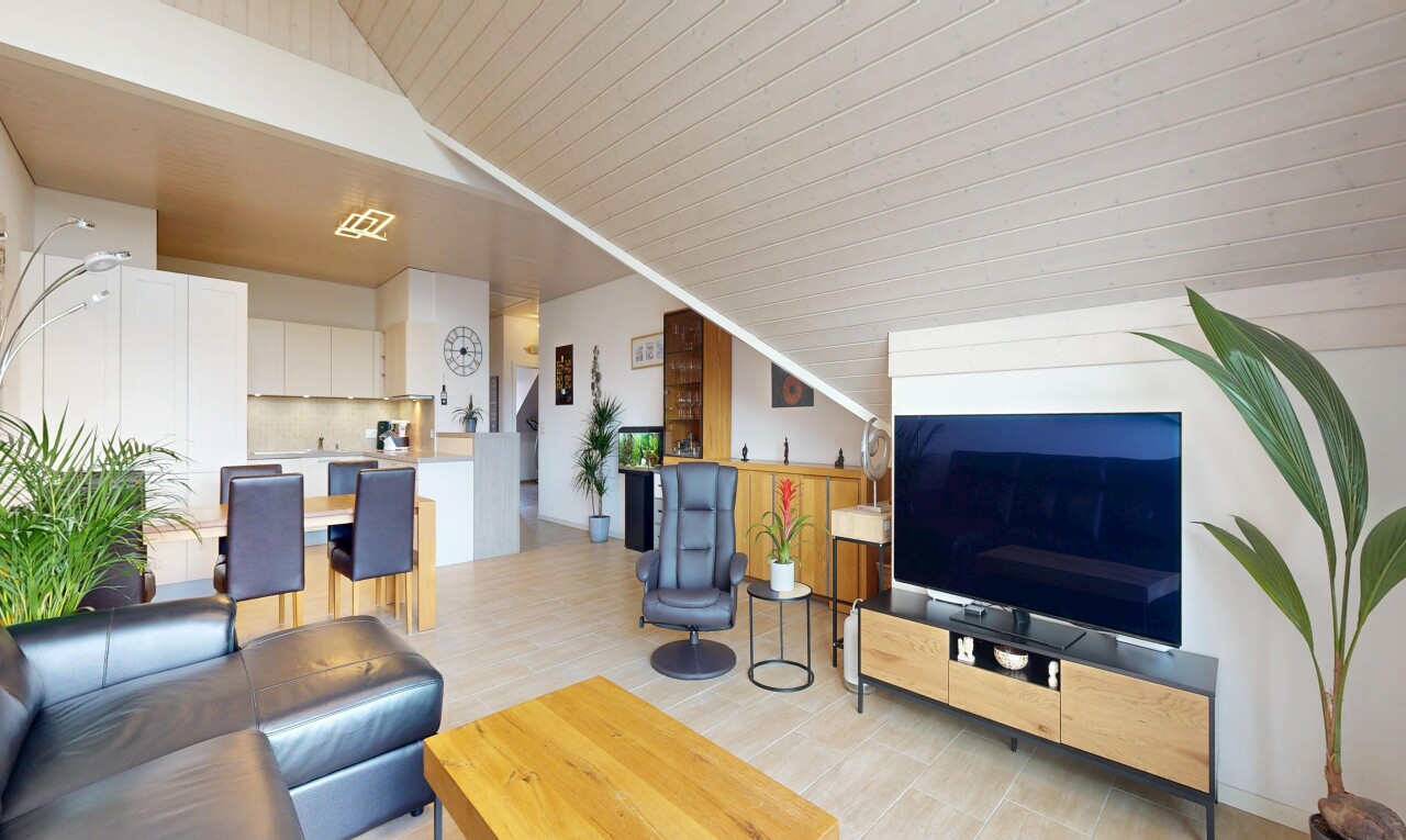 living area featuring vaulted ceiling and light wood-type flooring