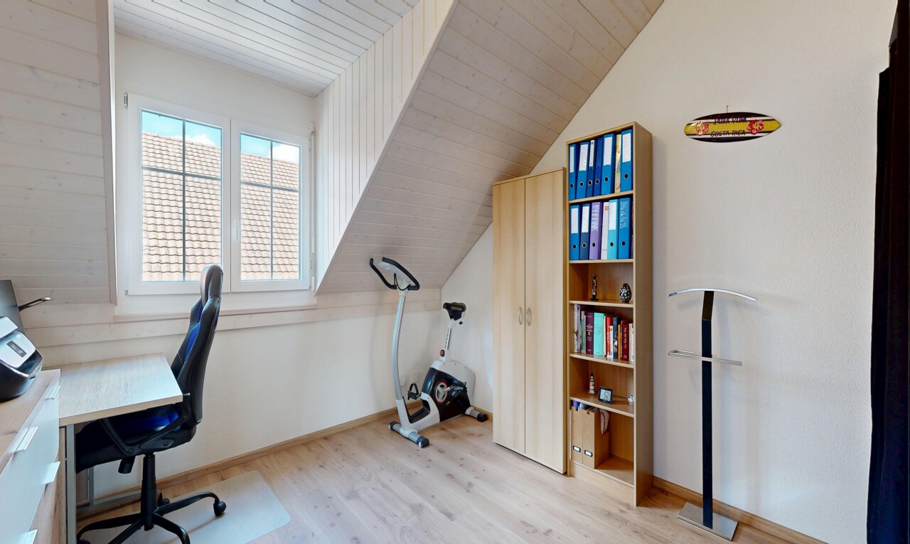 office area featuring light wood finished floors and lofted ceiling