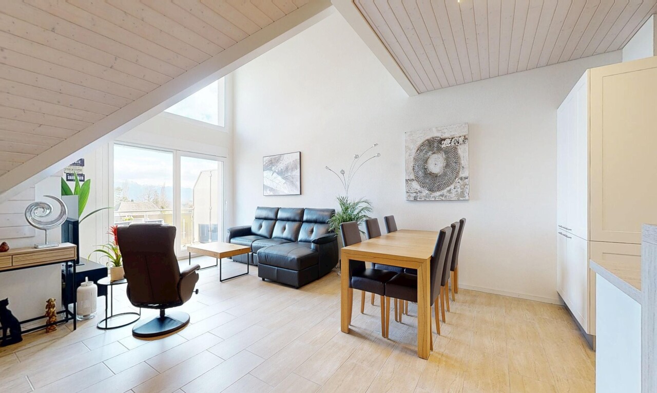 living room with a vaulted wood ceiling