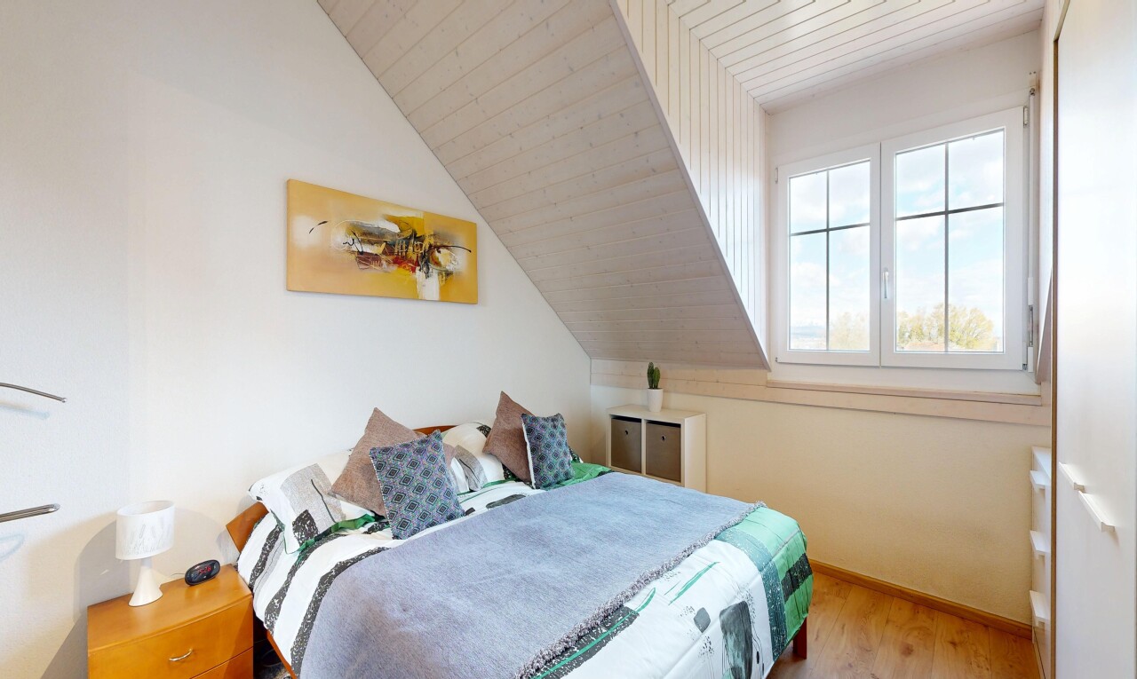 room with a vaulted wooden ceiling and light wood-style floors