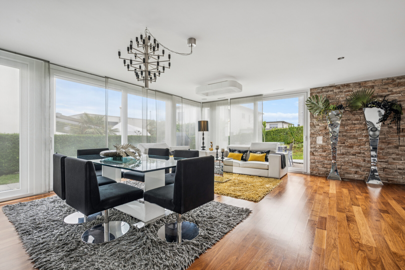 living room featuring light wood-type flooring and expansive windows