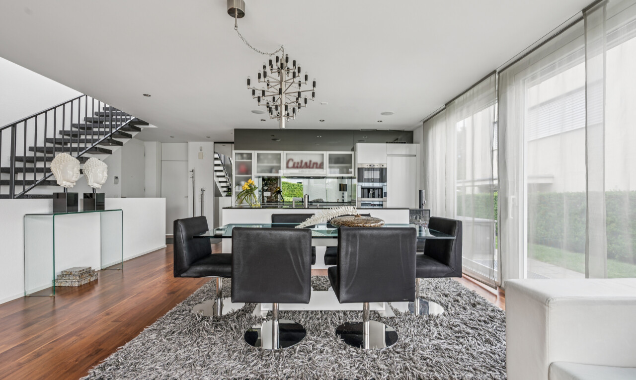 dining room featuring dark wood-type flooring and healthy amount of natural light