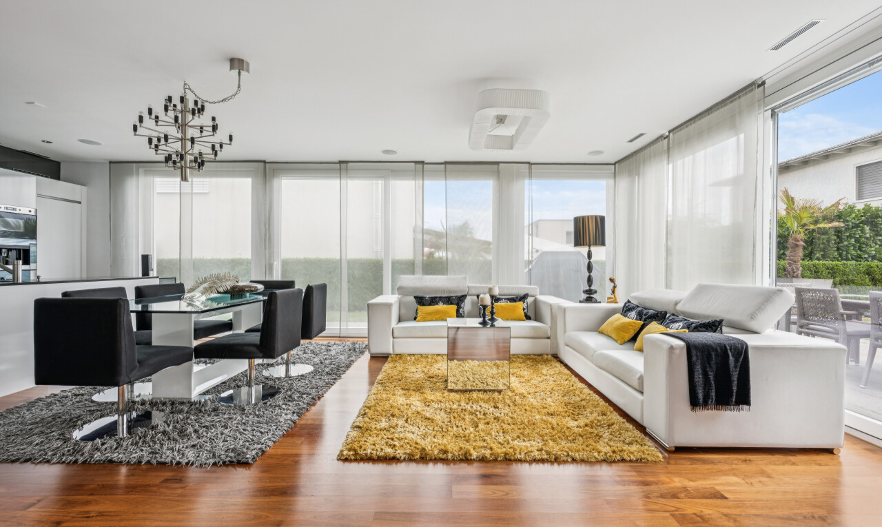 living / dining room featuring wood finished floors and expansive windows