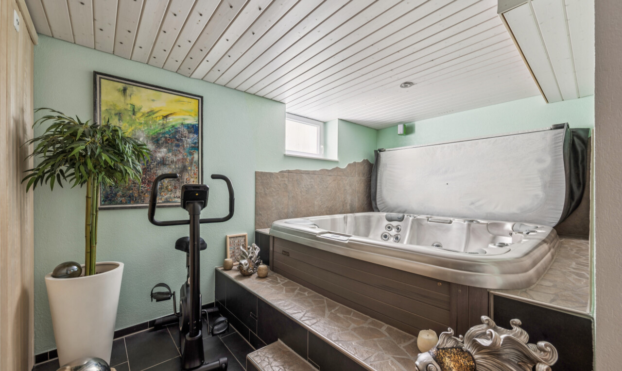 detailed view of a whirlpool tub and wooden ceiling