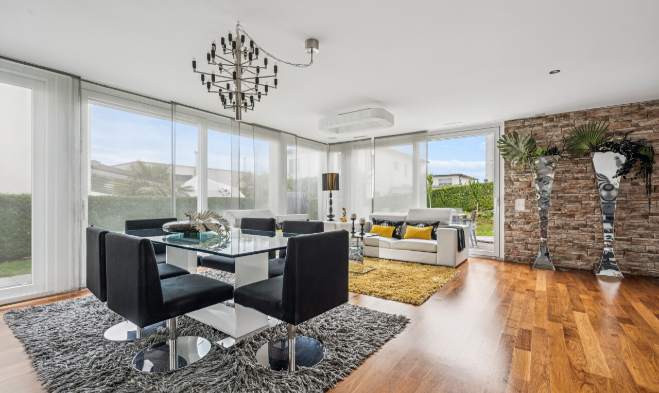 living room featuring light wood-type flooring and expansive windows