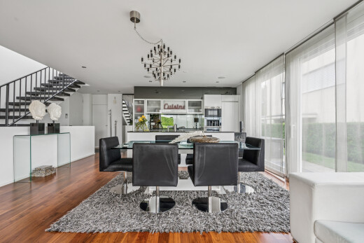 dining room featuring dark wood-type flooring and healthy amount of natural light