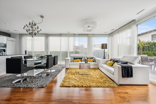 living / dining room featuring wood finished floors and expansive windows
