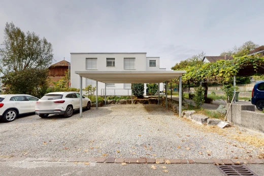 außenansicht mit property visible und freistehender carport