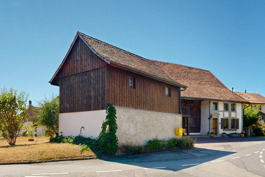 façade avec day time, bardage en bois, property visible, et bardage en stuc