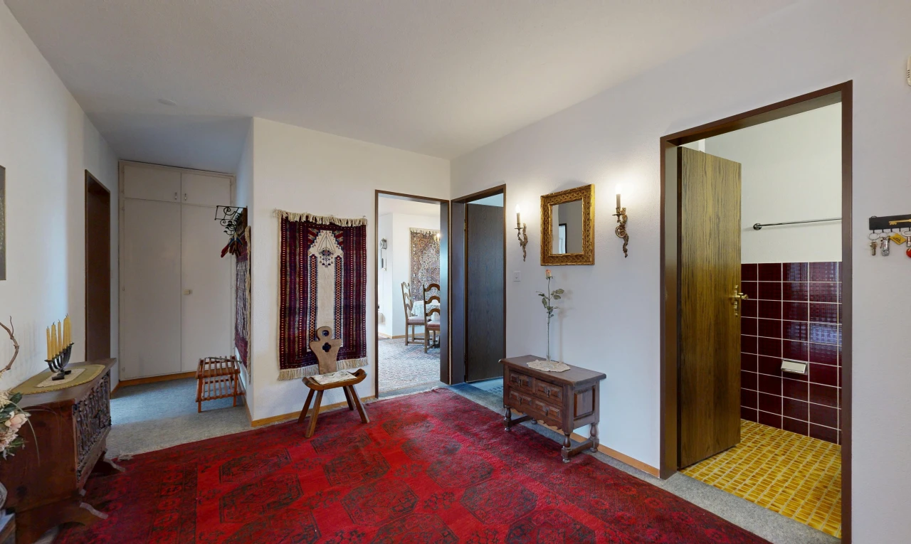 couloir avec drywall, cloison sèche, carpet, moquette, et inside property