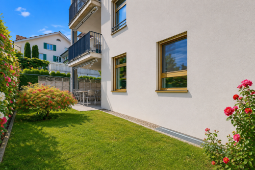 view of home featuring a balcony and stucco siding
