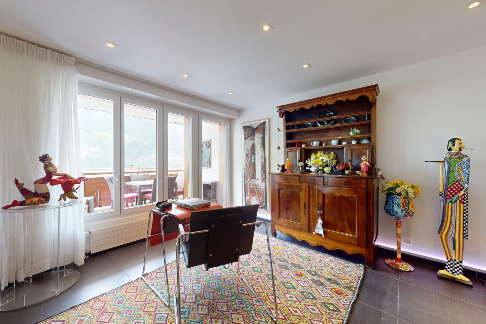tiled living area with plenty of natural light and recessed lighting