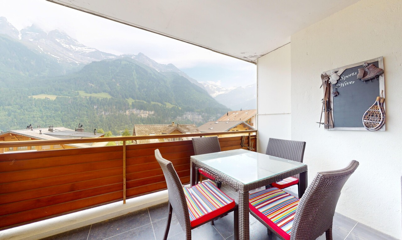terrace featuring a mountain view