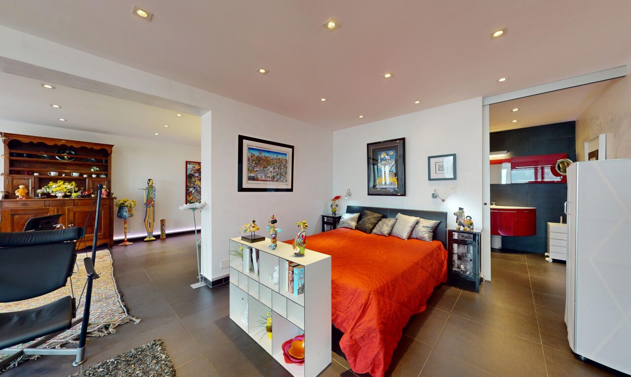 room / bedroom featuring recessed lighting and freestanding refrigerator