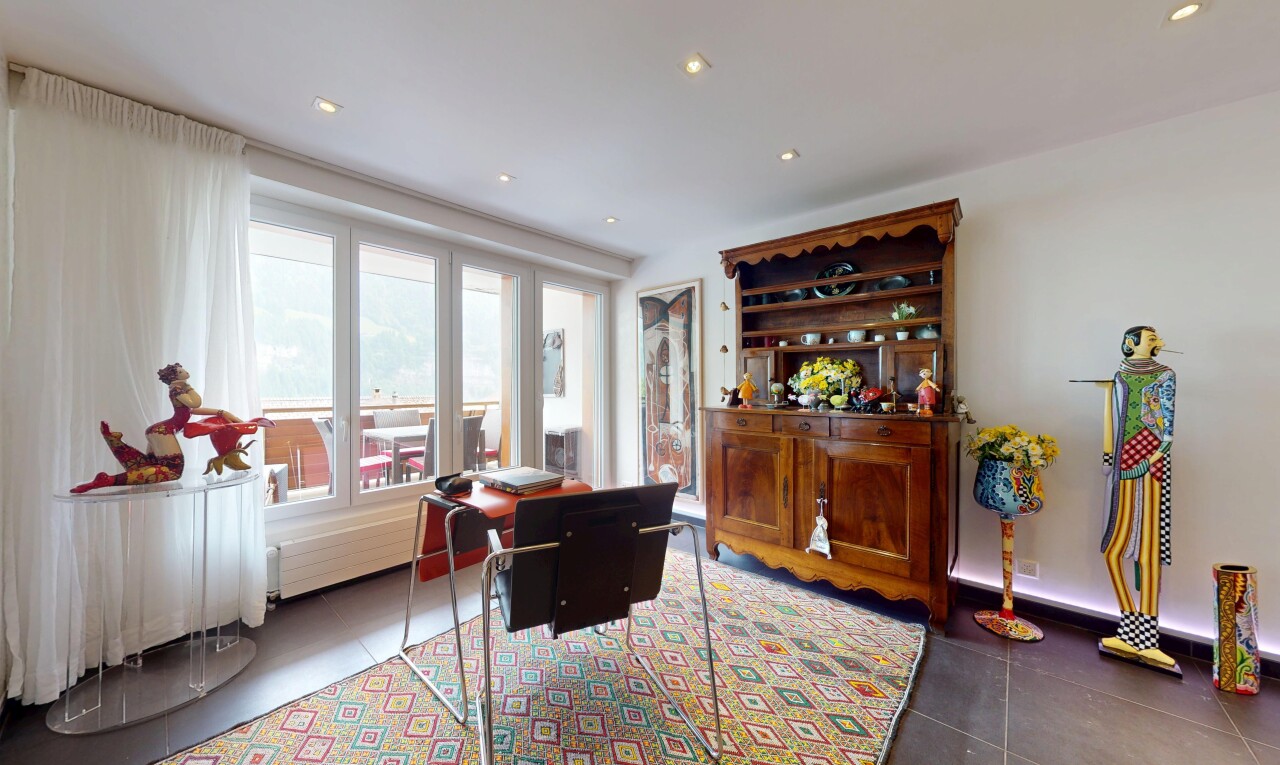 tiled living area with plenty of natural light and recessed lighting