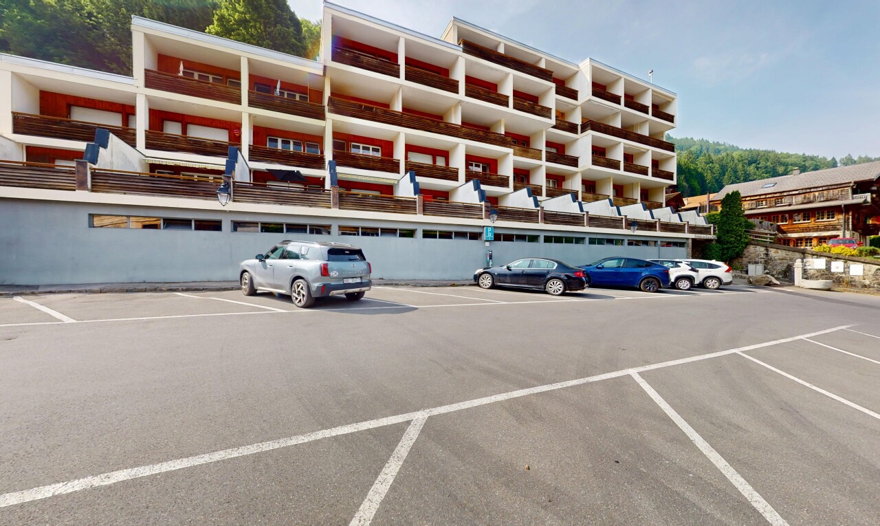 view of property with uncovered parking