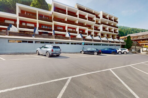 view of property with uncovered parking