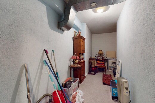 hallway featuring light colored carpet
