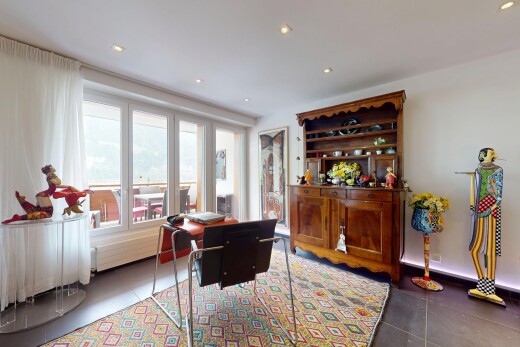 tiled living area with plenty of natural light and recessed lighting