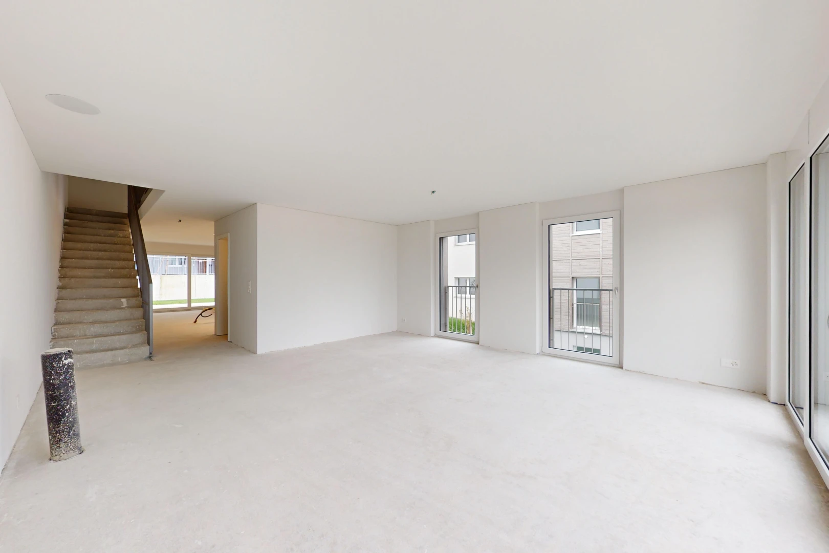 carpeted spare room featuring a wealth of natural light