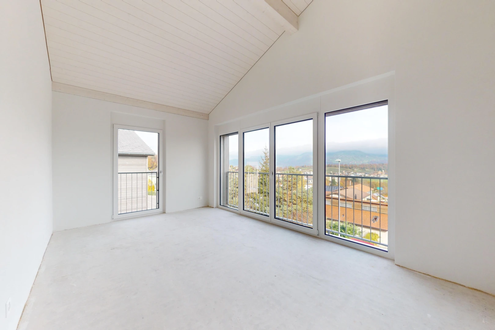 spare room with carpet flooring, beam ceiling, and high vaulted ceiling