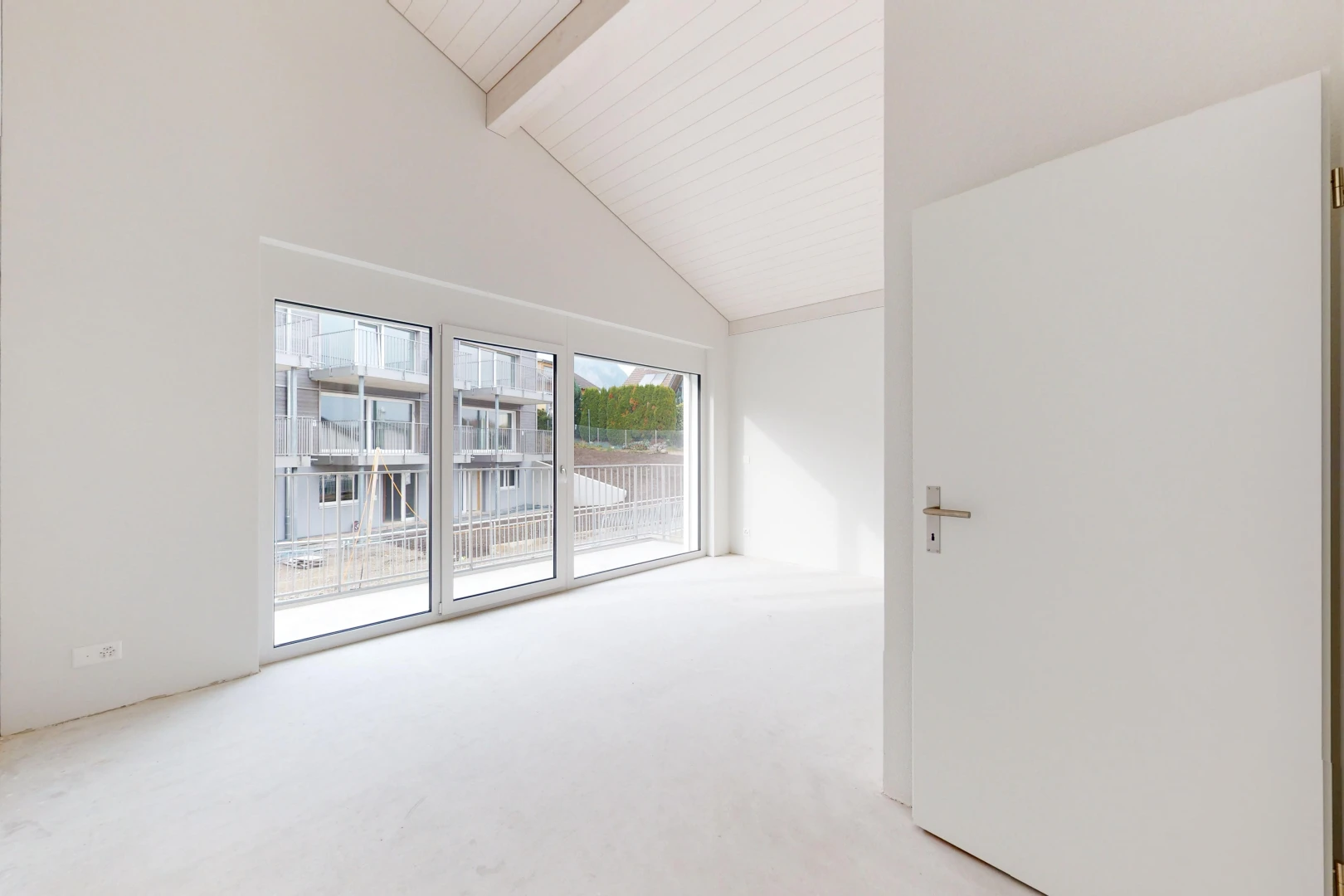unfurnished room with beamed ceiling, light colored carpet, and high vaulted ceiling