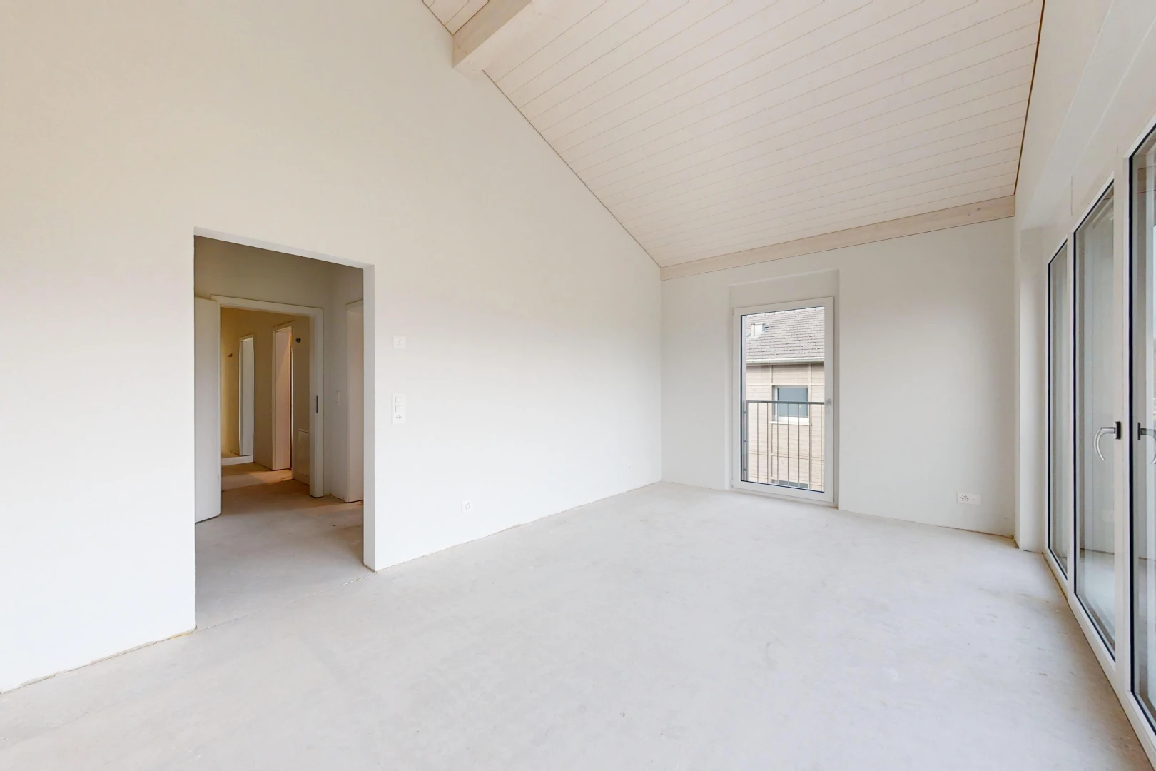 empty room with beam ceiling, light carpet, and high vaulted ceiling