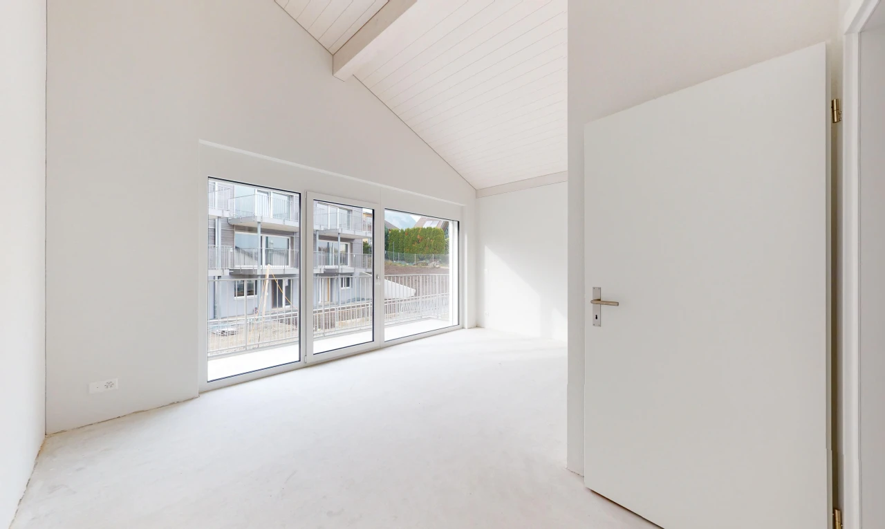 unfurnished room with beamed ceiling, light colored carpet, and high vaulted ceiling