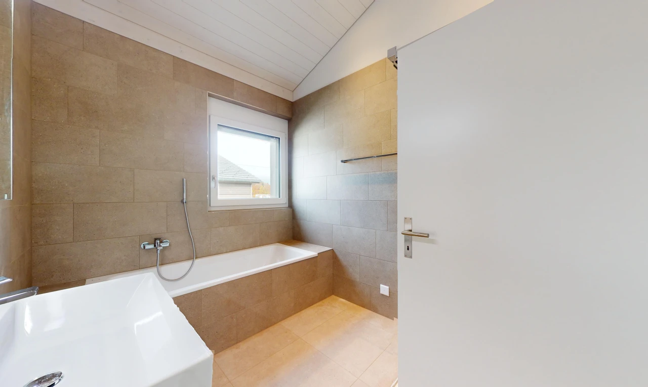 bathroom featuring separate shower and tub, tile walls, and lofted ceiling