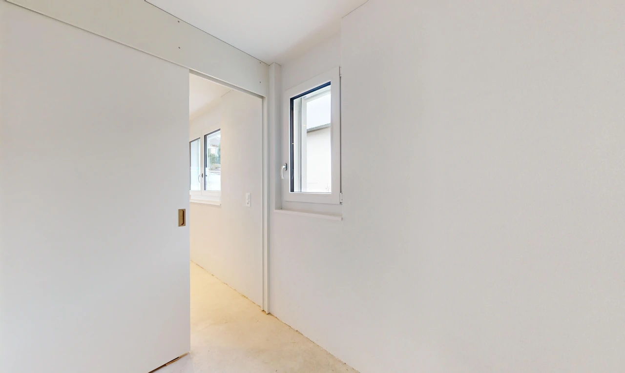 empty room featuring light colored carpet