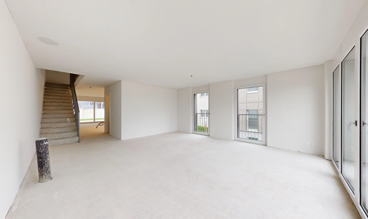 carpeted spare room featuring a wealth of natural light