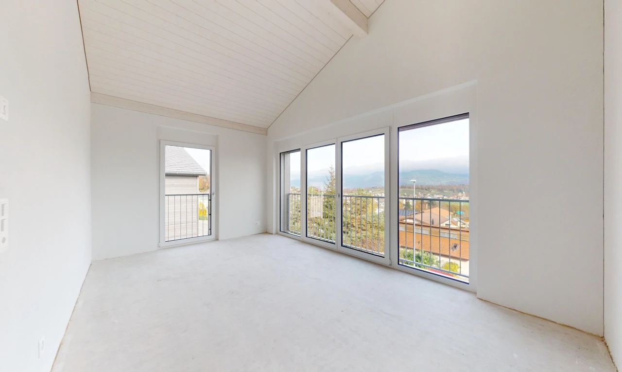 spare room with carpet flooring, beam ceiling, and high vaulted ceiling