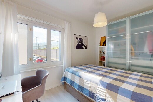 room with baseboards and wood finished floors