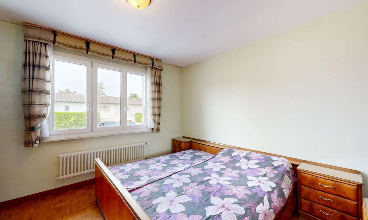 room / bedroom with radiator heating unit and parquet floors