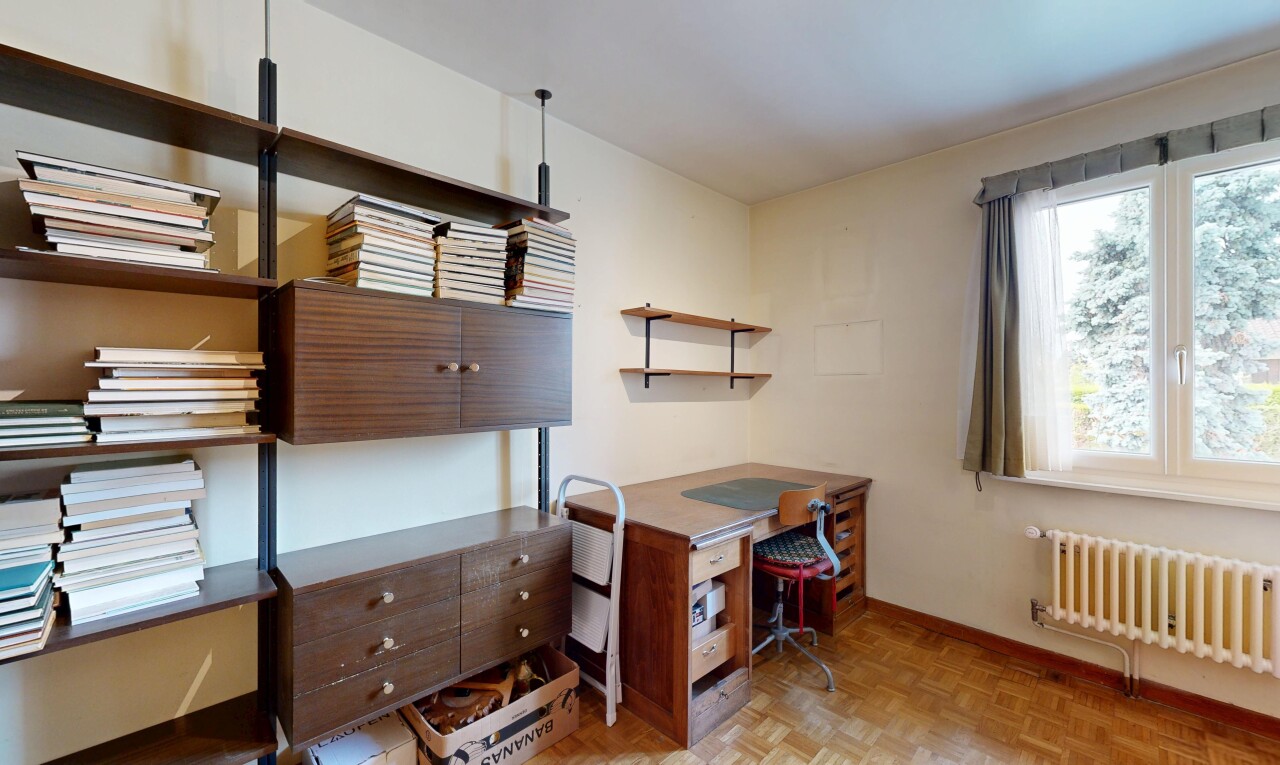 home office featuring parquet floors and radiator heating unit
