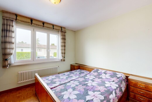 room / bedroom with radiator heating unit and parquet floors