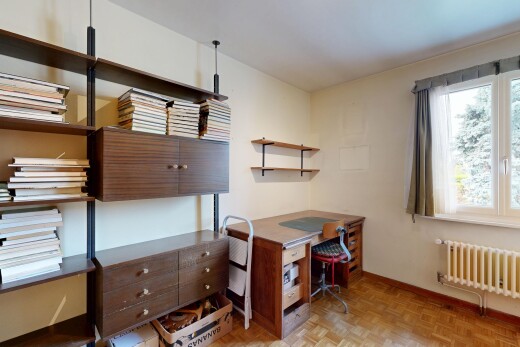 home office featuring parquet floors and radiator heating unit