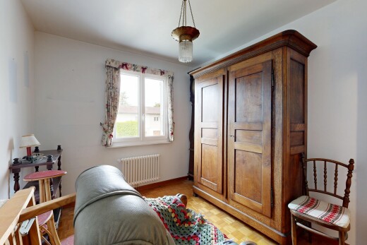 room / bedroom with radiator heating unit, parquet floors, and hanging light fixtures