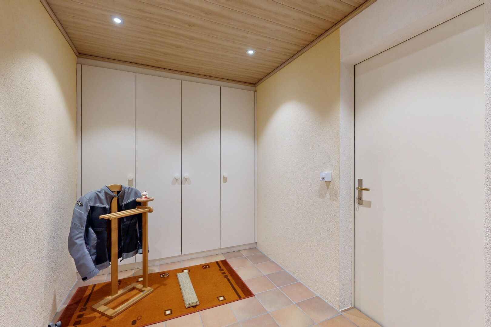 hall with wooden ceiling, recessed lighting, and a textured wall