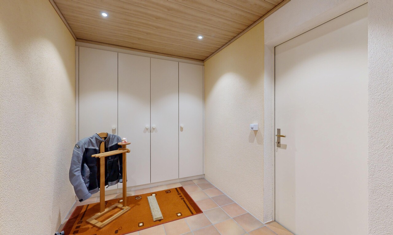 hall with wooden ceiling, recessed lighting, and a textured wall