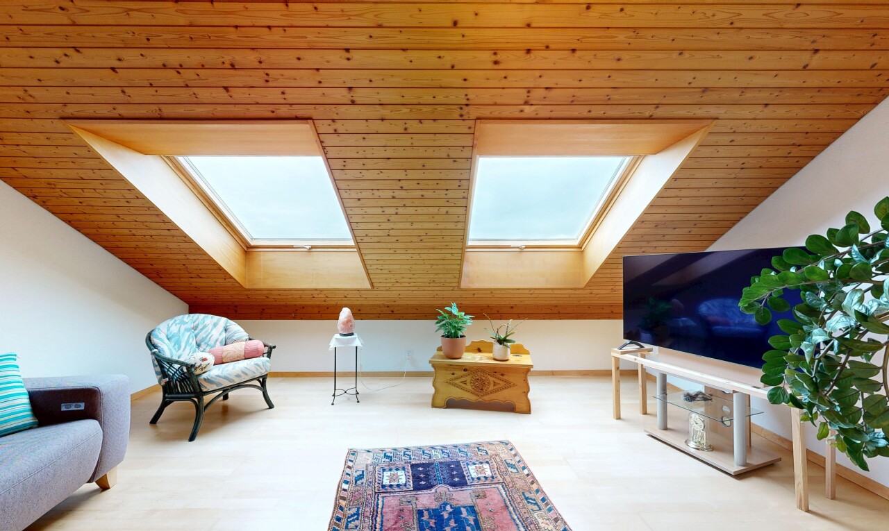 living room featuring a skylight