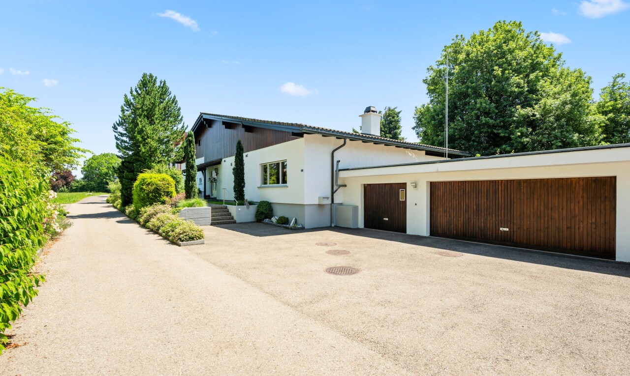 terrace with driveway and a garage