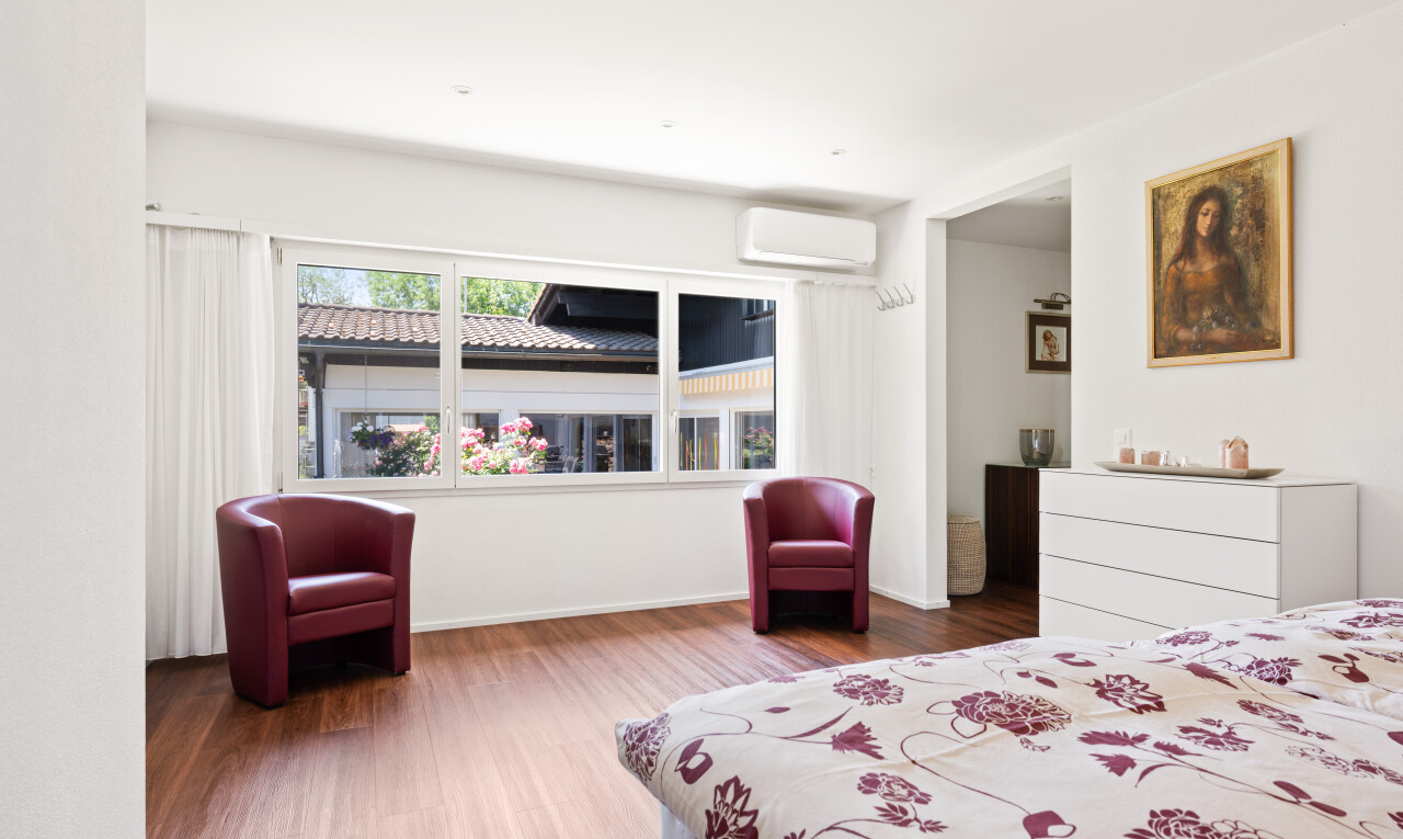 room with dark wood-type flooring and recessed lighting