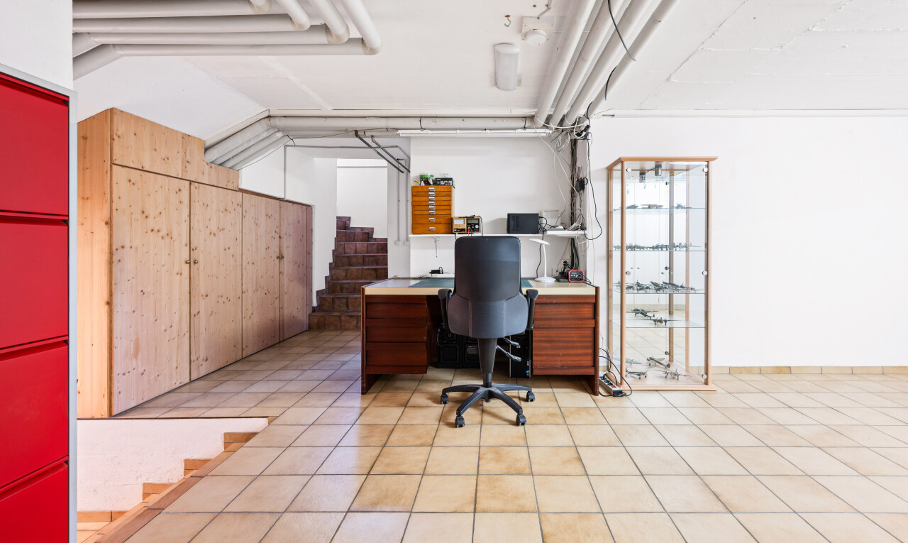 office space featuring stairway and light tile patterned floors